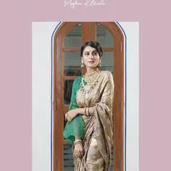 A full view of the jewelry styling against an ethereal saree. The contrast of the green blouse and emeralds in the jewelry creates a harmonious and sophisticated look, perfect for a bride who loves classic elegance.
