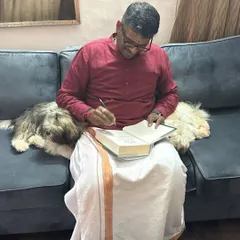 A personal moment signing a book in Mangaluru, accompanied by two affectionate Shih Tzus, Benji and Oreo. My visit also included darshan at the powerful temples in and around the region.