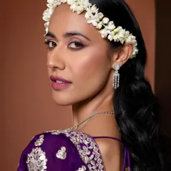 I call this "mehendi makeup, but make it editorial." For this jewellery shoot, I created a look with defined, smoky eyes and a fresh pink lip, complemented by a beautiful gajra headband. It’s a modern interpretation perfect for a fashion-forward campaign.
