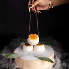 Sometimes a product calls for a dark, moody, and dramatic vibe. I use techniques like dry ice smoke to create a sense of luxury and precision, perfect for high-end restaurant menus.