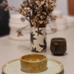 Another look at my Rakhi gift hamper, styled with a small bowl on a rustic plate. Each piece has a unique character that you won't find in mass-produced items.