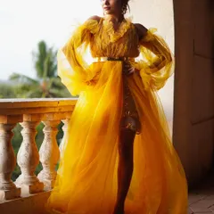 A vibrant, high-fashion shot featuring actress Manisha Rani. The flowing yellow tulle gown against the open-air balcony setting shows my ability to create dramatic, editorial-style images in any location.