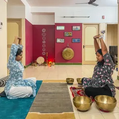 A private session in progress, where I guide a student through gentle yoga postures before the sound bath begins. This combination helps prepare the body and mind to fully receive the healing benefits of the sound vibrations.