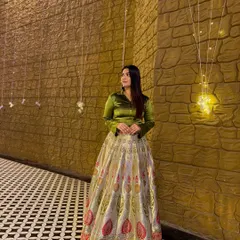 A full-length view of the satin shirt and Banarasi lehenga combination. This fusion look is perfect for a wedding reception or a festive evening party.