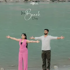 A playful "beach day" photo of an expecting couple with their arms outstretched, embracing the open space by the Ganga. This captures a feeling of freedom and joy.