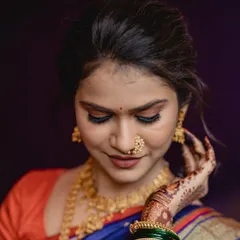 A close-up of this bride's engagement makeup. I focused on creating a flawless, glowing base with soft smokey eyes and a classic Maharashtrian nath to enhance her natural beauty.