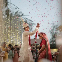 The varmala is a moment of pure joy and union. We ensured this beautiful Assamese-Sindhi fusion wedding had the perfect backdrop, with a shower of petals and a sky full of fairy lights, making the moment truly magical.