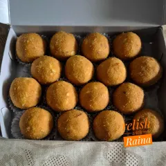 These are Yellow Moong Daal Laddoos, a healthy and delicious option. Moong daal is rich in protein and fiber, and these laddoos are made with less ghee.