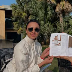 Holding the Harper's Bazaar issue featuring my article. It's a moment of deep gratitude, a reminder of what unfolds when we surrender to the divine flow.