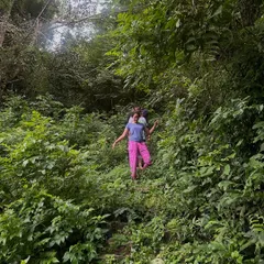Exploring the lush green paths of my home. My philosophy is rooted in reconnecting with nature and our origins.