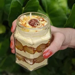 Introducing our Thandai Gulab Jamun Mousse Jar. This festive creation layers decadent gulab jamuns with a subtly spiced thandai-flavored mousse cream. The earthy thandai balances the sweetness of the gulab jamun perfectly.