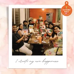 A happy group proudly displays their collaborative artworks from our Canvas Carousel session. This activity is a fantastic way to foster teamwork and creativity for corporate teams.