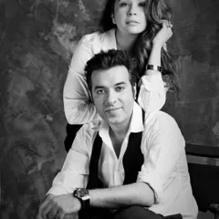 A chic black and white portrait of fashion designer Sonaakshi Raaj and restaurateur Nikhil Merani. This image captures their essence as a modern power couple.