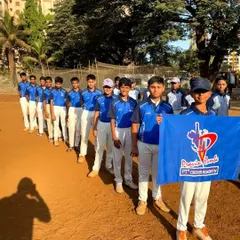 The U-14 Blue Team, presenting their team flag. This pre-tournament parade is a key part of building excitement and team identity.