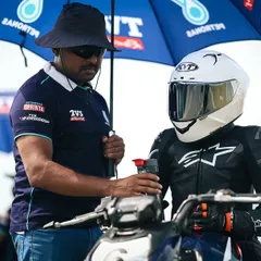 Mentorship is at the core of our program. Here, one of our senior coaches provides direct, one on one feedback to a rider in full race gear, right on the grid before a session. We are with you every step of the way.
