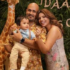 A beautiful family portrait amidst the fun of the party. Even during a busy event, I find moments to capture the core of the celebration: family. Here are Idaan's proud parents with the birthday boy.