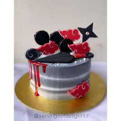 An anime-themed cake for a true fan. This design features iconic symbols from the Naruto series, including the Akatsuki cloud and a kunai knife, with a dramatic red drip.