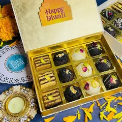 This elegant gold box is filled with an assortment of my handcrafted Diwali sweets. It includes rich chocolate truffles and nutty almond bars, making it a perfect gift for friends and family.