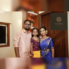 Creating coordinated outfits for the entire family is one of my greatest passions. Here, we designed a cohesive look for a family event, using complementary colors and traditional fabrics. The daughter’s custom Pattu Pavadai perfectly harmonizes with her parents' elegant ethnic wear.