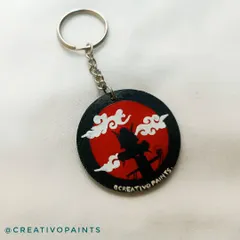 For the anime fans, here is a hand-painted keychain featuring the iconic Akatsuki cloud from Naruto. The bold red and black design makes this a striking accessory for your keys or bag.