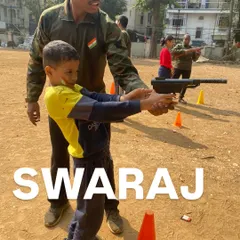 Here is Swaraj, learning how to handle a pistol safely with guidance from one of my instructors.