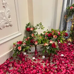 I use beautiful wicker baskets filled with fresh flowers and surrounded by LED candles to decorate floor spaces and corners, adding to the overall romantic feel.