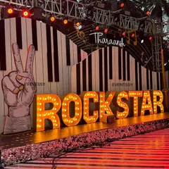 For a high-energy 5th birthday, I designed this full rockstar concert stage. It features large marquee letters, a custom piano key backdrop, and stage lighting to make the birthday boy feel like a true star.