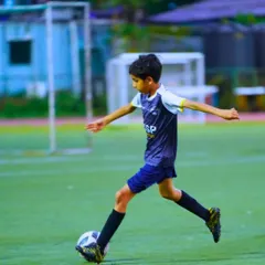 A young player perfects his passing technique. Every drill is a step towards mastering the fundamentals of the game.
