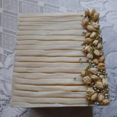 This is my Cooling Ice Apple soap, one of the most elegant bars I've ever made. The design is inspired by nature, with delicate ridges and real dried jasmine buds, making it a beautiful and functional piece of art for your bathroom.