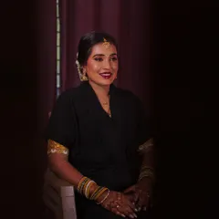 Capturing the beautiful bride Dhanya during her getting-ready process. I love these quiet, candid moments before the main event, where the transformation begins to unfold.