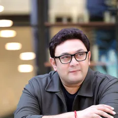 A candid, relaxed portrait of Rajesh Kumar, famous for his role in 'Sarabhai vs Sarabhai'. This shot captures a more natural and approachable side, essential for showing an actor's range beyond their iconic characters.