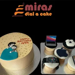 A tech-lover's dream, this set includes a personalized cake for "Appa" and matching cupcakes. Each cupcake is topped with a different edible Apple gadget, from a MacBook to an iPhone and Apple Watch.