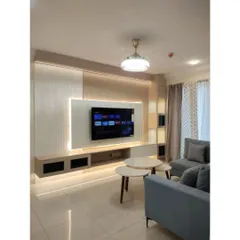 The full composition of a modern living room, featuring a sleek TV unit with ambient backlighting, a comfortable L-shaped sofa, and nesting coffee tables. Every element is designed to work in harmony, creating a balanced and inviting atmosphere.