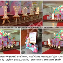 A classic unicorn theme for Siyona's first birthday. The decor includes a circular backdrop with a unicorn, a colorful balloon arch, and themed cylinder tables, perfect for a magical celebration.