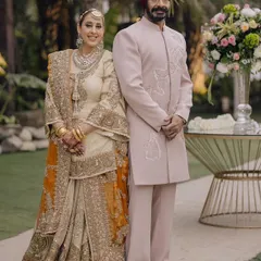 A portrait of timeless elegance. This client wears a custom-made, pale pink bandhgala with subtle white embroidery, perfectly coordinated for a daytime family wedding. His calm confidence shines through.