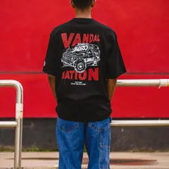 A full shot of the T-shirt being worn, showing how the oversized fit and graphic look in a real-world context.