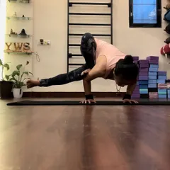 A close-up of the side crow pose, showing the engagement of the core and the placement of hands. Arm balancing is one of my favorite ways to practice focus and strength.