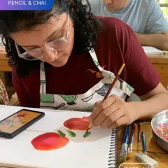An artist-in-the-making concentrates on her still life painting. We believe in learning to see, and our classes emphasize observational drawing and painting to build a strong artistic foundation.