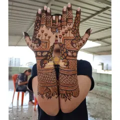 A full-coverage back-hand design with a variety of traditional elements. This pattern includes peacocks, elephants, lotus flowers, and intricate checkwork for a rich and textured look.
