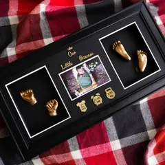 Learn to create diverse styles, like this elegant keepsake in a black frame. This piece for a little princess combines golden casts with a central photograph and custom nameplates, showing how different components come together to tell a story.