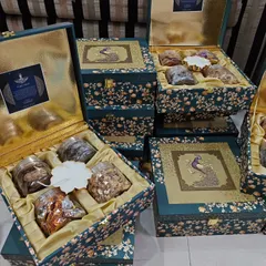 A collection of my exclusive peacock-themed wedding boxes, perfect for luxury wedding invitations or as premium 'bhaji' boxes.