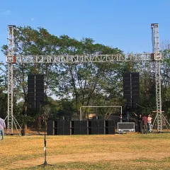 Our L-Acoustics K2 & Kara system being set up for an outdoor event. This photo shows the full rig, including the speaker arrays and subwoofers, demonstrating the professional-grade infrastructure we bring to every production.
