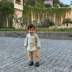 Dressing up the little ones is a joy. This adorable kurta for a young boy is made from our soft and comfortable slub silk, perfect for festive family gatherings.