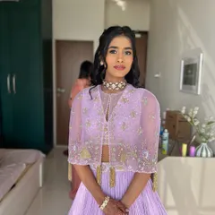 Radiating elegance in soft purples. This look is perfect for a daytime event or a cocktail party.
