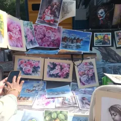 A display of my various watercolor paintings at the Chithra Santhe. You can see a range of subjects, from floral art to landscapes, which are all part of the foundational skills we build for portraiture.