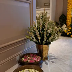 Details that make a house a home. For this Griha Pravesh, we placed brass urlis at the entrance, one filled with floating jasmine and candles, and the other with lotus buds.