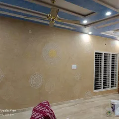 A closer look at the intricate mandala stencils on a textured base. This decorative finish is perfect for creating a focal point in living rooms or bedrooms, combining texture and pattern for a rich look.