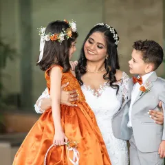 A sweet and candid moment between the bride and her adorable flower girl and page boy. These are the unscripted interactions that make for heartwarming photos.