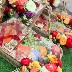 A closer look at our grand wedding shagan hamper. The vibrant colors of the fresh fruits and the rich floral arrangements make it a visually stunning gift that expresses gratitude and love in the most beautiful way.