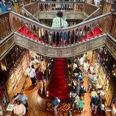As a lover of books and libraries, visiting Livraria Lello in Portugal was like being a kid in a candy store. The sheer scale and artistry of the space, with its grand wooden balconies and red staircase, is something pictures can't fully capture.